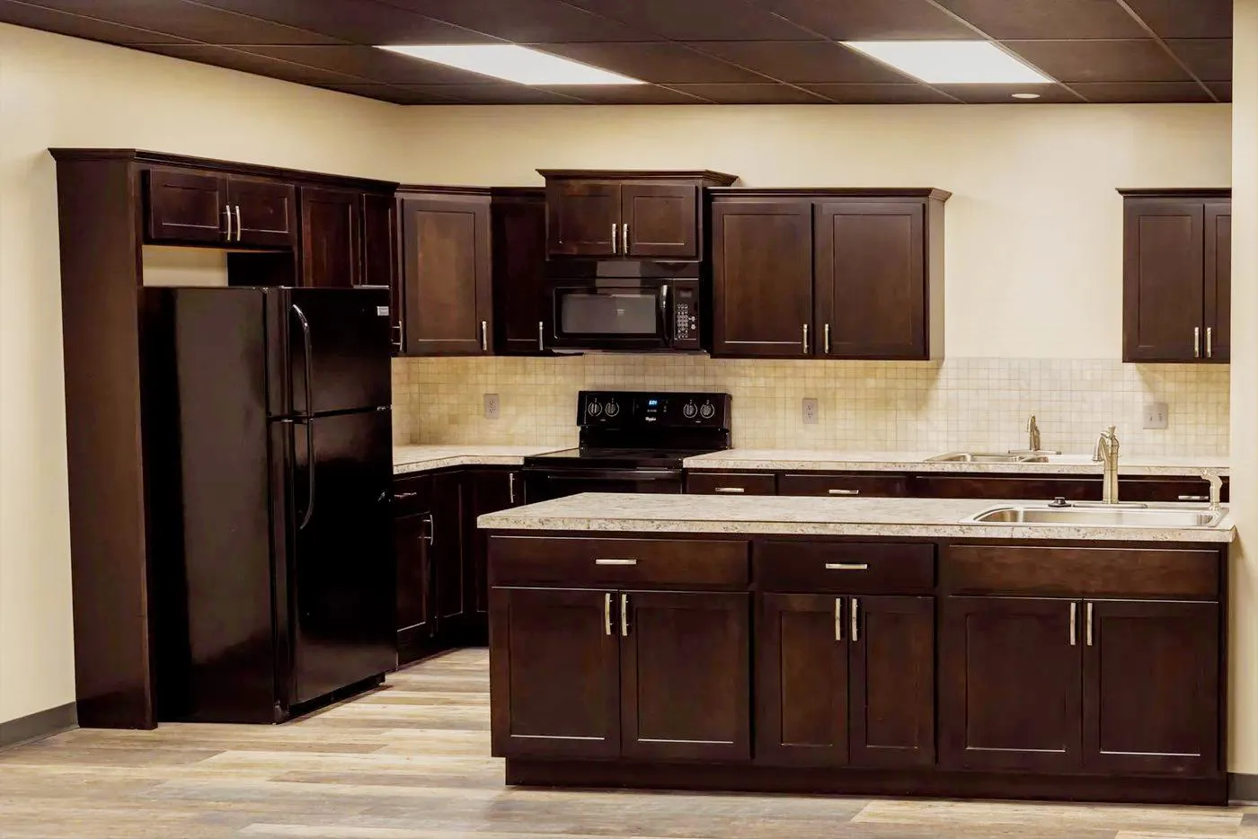 The on-site kitchen with full-size appliances, an island, and prep space